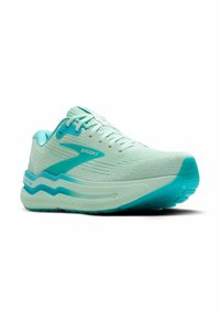 Baskets de course bleu clair avec une tige en mesh texturé, accents aqua contrastants, semelle rembourrée et forme contour pour le soutien.
