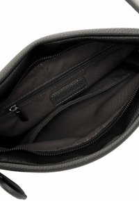 Gray leather bag interior with a smooth texture, featuring one zip pocket and a fabric lining. Black zipper and a decorative label are visible.