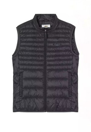 Gilet senza maniche in piumino nero con texture a righe orizzontali, zip frontale e due tasche laterali. Presenta un piccolo logo sul petto.