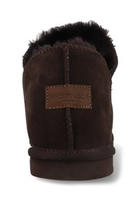 Brown suede slipper with faux fur lining, featuring a stitched seam and leather brand patch on the back. Soft texture and low-profile design.