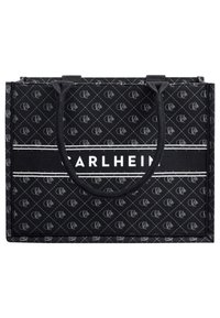 Black tote bag made of patterned material with white branding. Features two sturdy handles and a rectangular shape.