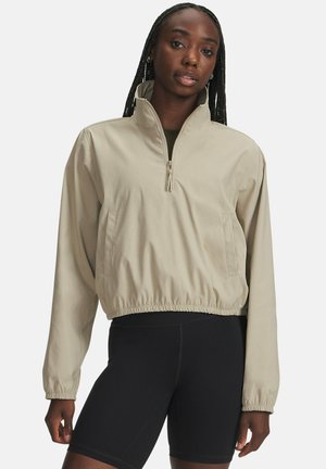 Beige, zipfelpulloverjacke mit lockerer Passform, elastischem Saum und langen Ärmeln. Mit Seitentaschen und hohem Kragen.