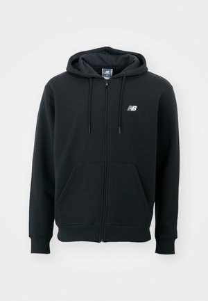 Black zip-up hoodie with a drawstring hood, front pockets, ribbed cuffs, and a small white logo on the left chest. Soft cotton blend material.