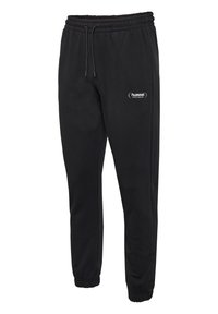Schwarze Sweatpants aus weichem Stoff, mit einem elastischen Bund und Kordelzug, schmal zulaufenden Beinen und einem kleinen weißen Logo auf dem Oberschenkel.