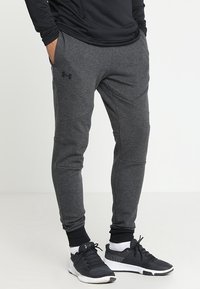 Under Armour Teplákové kalhoty - black