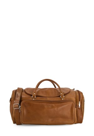 Brown leather duffel bag with a rounded shape, dual top handles, adjustable shoulder strap, and front zippered pocket.