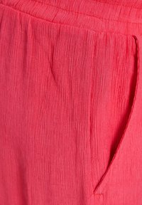 Bershka Kalhoty - coral