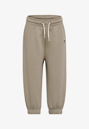 Beige joggerbukser med elastisk linning, snøre, ankelmanchetter og et lille broderet logo øverst til venstre. Ingen synlige lommer.