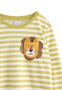 Striped long-sleeve shirt in light green and white, featuring a lion face applique with ears and a pocket. Soft, cotton material.