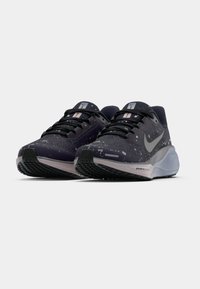 Pair of black and gray Nike Air Zoom running shoes with speckled pattern and black laces on a white background.