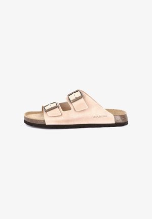Sandalo ciabatta in camoscio beige con due fibbie metalliche regolabili e sottopiede sagomato in sughero, progettato per comfort e uso casual.