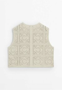 Krämfärgad virkad ärmlös väst med fyrkantiga blommotiv arrangerade i ett rutmönster, visad platt bakifrån.