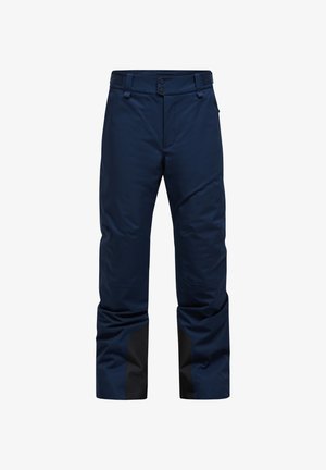 Pantalones de esquí azul marino con una textura suave, cintura ajustable con Velcro y detalles en negro en las piernas inferiores por durabilidad y estilo.