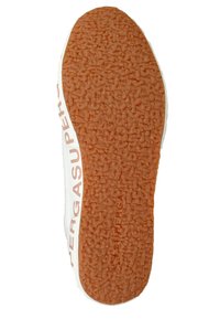 White shoe sole with textured orange rubber, featuring a raised pattern and embossed "SUPERGA" branding along the side.