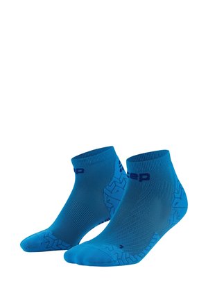 Blue athletic socks with a textured design, featuring a short cuff and contrasting logo. Made from a stretchy material for comfort.