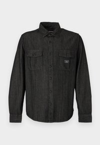 Black denim shirt with button front, pointed collar, and two chest pockets. Features a subtle striped pattern and branded label on the pocket.
