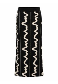 Jupe en tricot noire avec un motif ondulé crème et des lignes verticales subtiles, agrémentée d'une ceinture élastique noire pour un ajustement confortable.