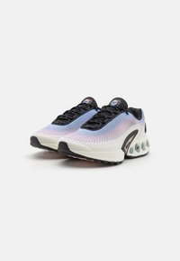 Running shoes with a mesh upper featuring a gradient from blue to pink, black laces, and a cushioned outsole with translucent accents.