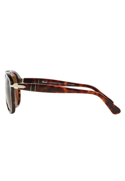 Gafas de sol redondas con una montura de carey oscura, lentes polarizados, acentos metálicos plateados y un diseño elegante. Fabricadas en Italia.