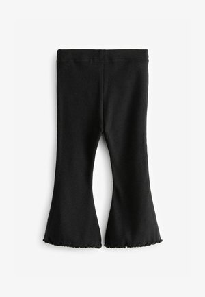 Čierne rebrované legíny s rozšírenými nohavicami a lemom s vlnami, vyrobené z mäkkého materiálu s elastickým pásom pre pohodlie a priliehajúci strih.