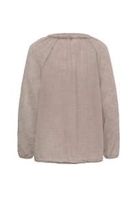 Blouse beige à manches longues en tissu texturé avec broderie florale sur les manches, vue de dos avec un col froncé et des poignets élastiques.