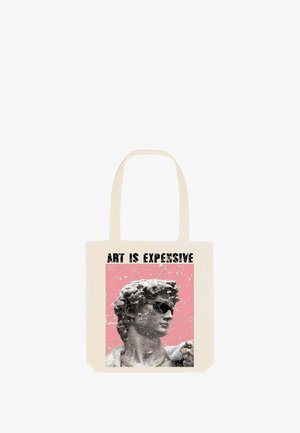 Canvas draagtas met een afbeelding van een klassieke standbeeld dat een zonnebril draagt, tegen een roze achtergrond, met de tekst "KUNST IS DUUR" erboven.