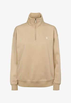 Bézs színű polár pulóver magas gallérral, fél cipzáros elülső résszel, bordázott mandzsettákkal és egy kis hímzett logóval a bal mellrészen.