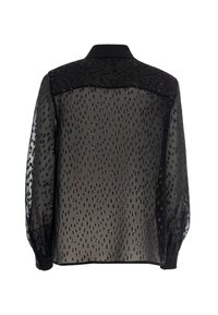 Black sheer blouse with a textured pattern of small dots, long sleeves, a collar, and buttoned cuffs. The back features a transparent design.