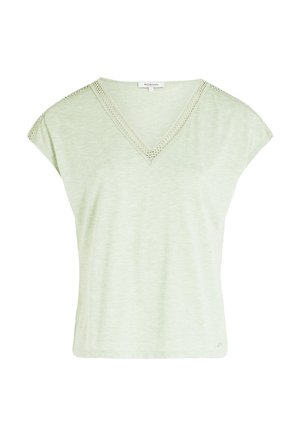 Haut vert clair à manches courtes avec un col en V et une dentelle le long de l'encolure. Fabriqué en tissu doux et texturé. Coupe décontractée.