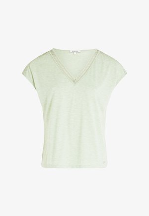 Haut vert clair à manches courtes avec un col en V et une dentelle le long de l'encolure. Fabriqué en tissu doux et texturé. Coupe décontractée.