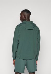 Nike Performance FORM - Training jacket - vintage green/reflective silver
