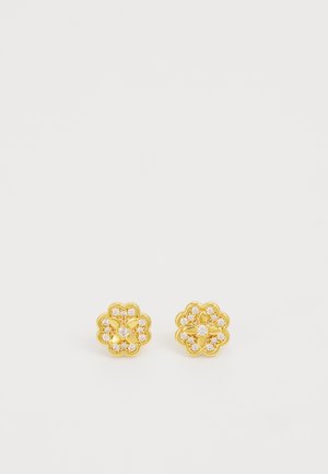 Paquet de petites boucles d’oreilles en forme de fleur en or avec des cristaux clairs incrustés autour des pétales et du centre sur fond blanc.
