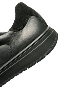 Black sneaker with a smooth leather body and suede accents. Features a rounded toe and textured rubber outsole, providing grip and support.