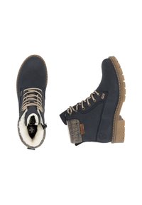 Bottines bleu marine avec un accent en laine texturée, lacets beiges et une semelle en caoutchouc épaisse, dotées d'une doublure en polaire confortable.