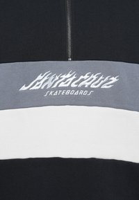 Zwart, grijs en wit kleurverloopt sweatshirt met rits en wit, vlamstijl "Santa Cruz Skateboards" logo geborduurd op de borst.