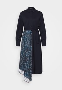 Vestito navy con bottoni e maniche lunghe, caratterizzato da un pannello gonna blu con un motivo floreale e rifiniture bianche a contrasto. Include una cintura in tessuto.