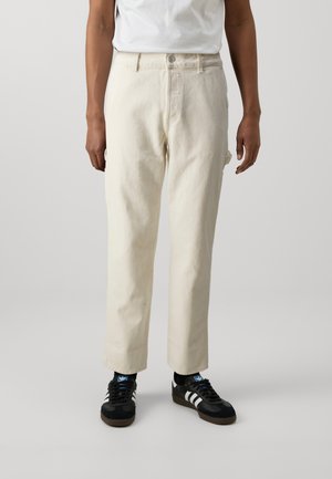 Light beige trousers with a straight-leg cut, made from cotton. Features a front button closure, belt loops, and side pockets.