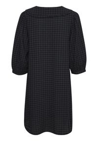 Vestido a cuadros en negro y gris con mangas de globo largas, un cuello redondo y un corte holgado. Fabricado con un tejido liviano y texturizado.
