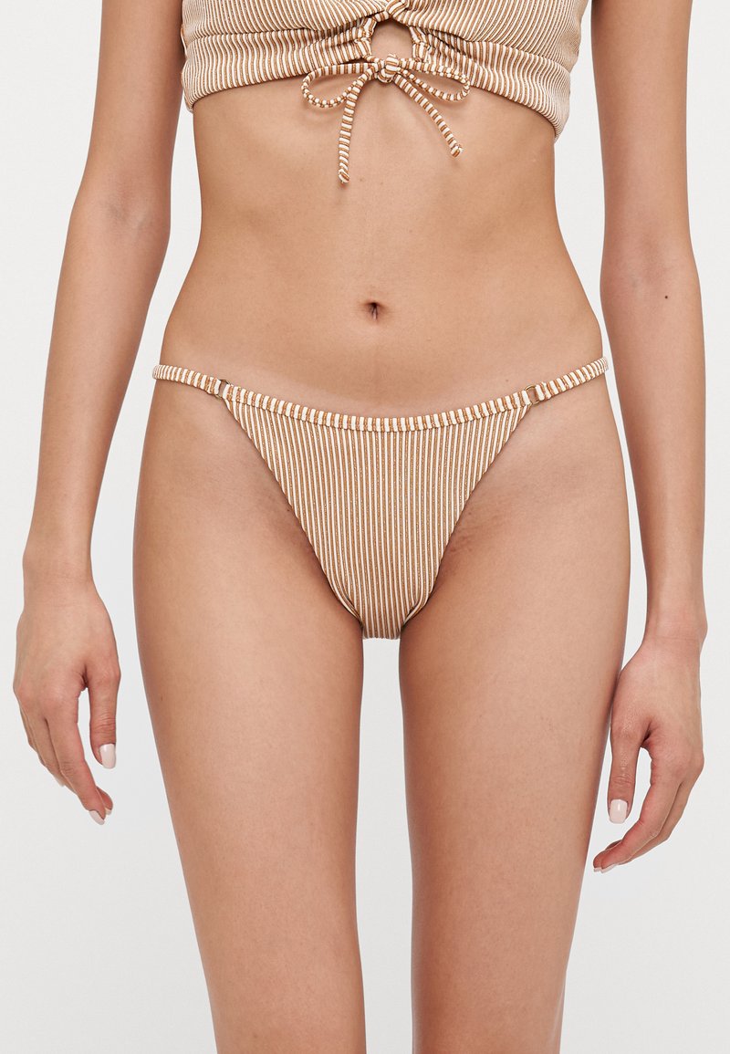 Striped bikini bottom featuring a low rise, thin side straps, and elastic material in brown and cream tones, with a smooth texture.