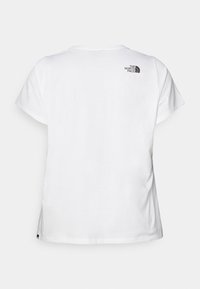 Hvid bomuld t-shirt med korte ærmer, afslappet pasform. Har et lille sort logo på den øverste ryg og en lige kant.
