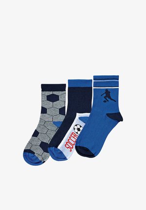 Three pairs of children's socks in blue and gray; one with soccer ball pattern, one with "SOCCER" text and ball, and one with soccer player silhouette.
