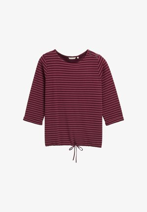 Maglietta a maniche lunghe a righe marrone e bordeaux con scollo a barca, dettaglio dei bottoni laterali e orlo con cordoncino. Tessuto morbido con vestibilità comoda.
