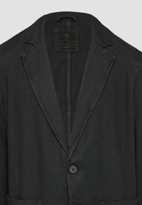Schwarzer Blazer mit Reverskragen, Ein-Knopf-Verschluss und strukturiertem Stoff. Enthält ein Innenetikett mit der Größe L.