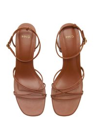 Brown strappy high-heeled sandals with a square toe, flat platform, and ankle strap. Made of smooth synthetic material featuring minimal hardware.
