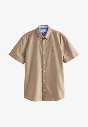 Camicetta a maniche corte, di colore khaki, con bottoni in cotone. Presenta un colletto, bottoni bianchi e un piccolo logo scuro vicino al petto.