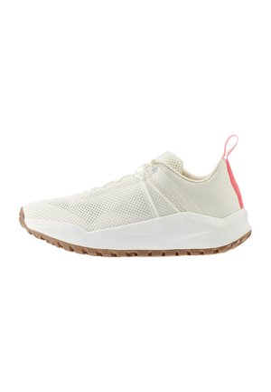 White athletic shoes with a mesh upper, featuring a pink accent at the heel and a textured rubber sole with traction patterns.