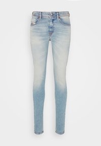 Ljusblå skinny jeans i denim, med en urtvättad finish, standard midja med bälteshål och fem fickor.