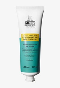 Il tubetto di pasta detergente di Kiehl's presenta un design bianco e verde acqua, con un tappo a chiusura flip-top, una capacità di 4,2 fl. oz. e del testo che indica il trattamento per imperfezioni.