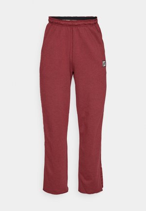 Pantalones de chándal burdeos hechos de una suave mezcla de algodón, con cinturilla elástica, piernas rectas y un pequeño parche del logo en el lateral.