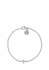Pulsera de cadena de plata con un diseño minimalista de cruz. Presenta un cierre de langosta y una pequeña etiqueta de marca unida a la cadena.